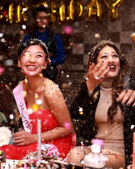 Confetti bursting over a birthday table